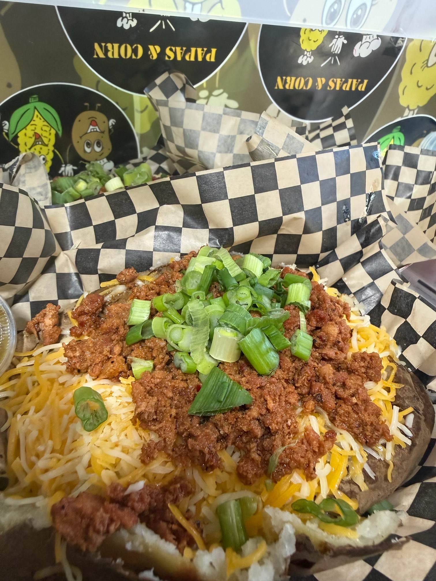 Placeholder photo of a loaded potato with extra toppings