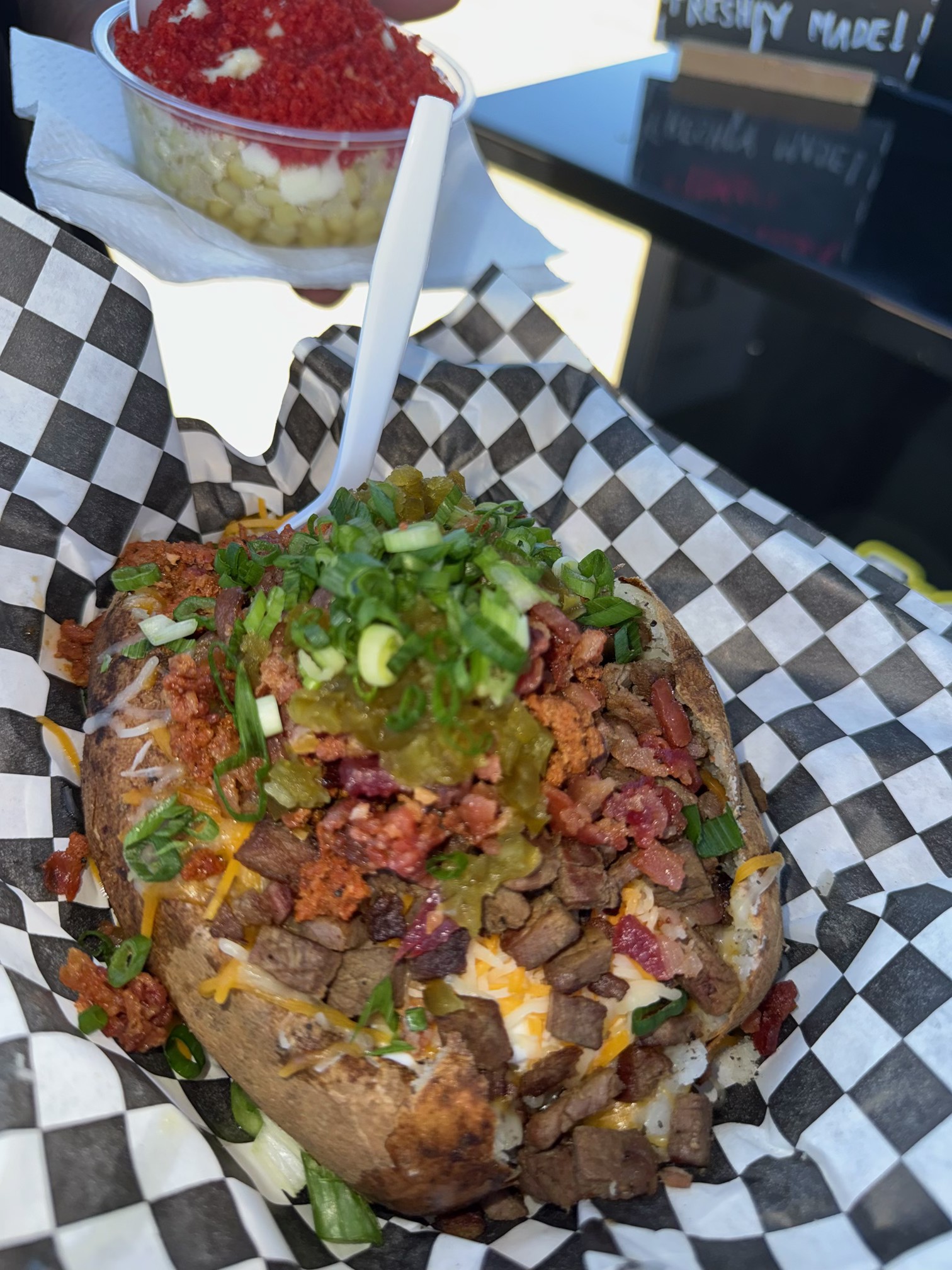 Placeholder photo of a loaded potato with extra toppings